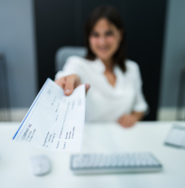 Woman handing check
