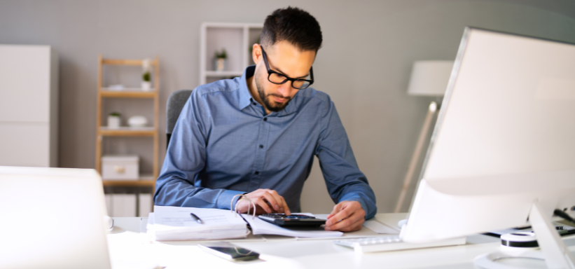 man using calculator